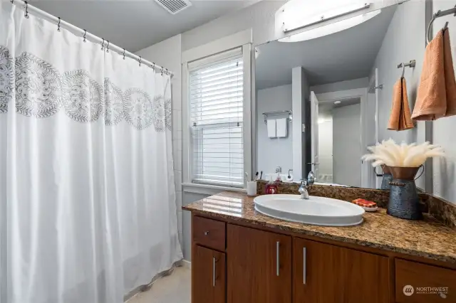 Full bath with privacy window.