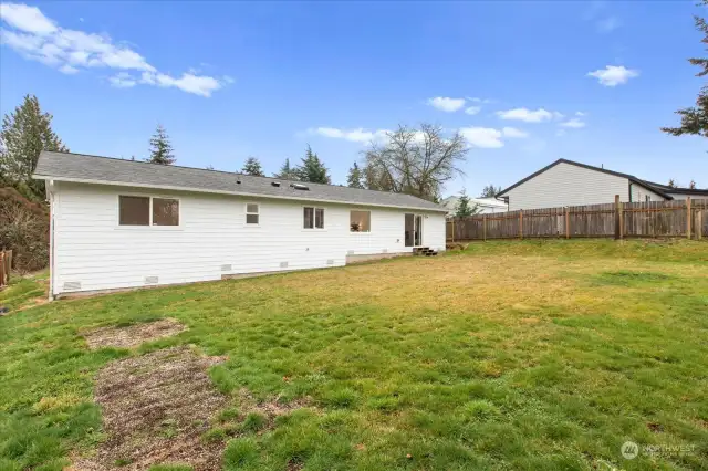 Generous back yard is a blank canvas waiting for you!