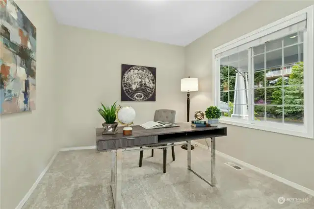 The main-level office has French doors, new carpet and paint, and overlooks the front yard.