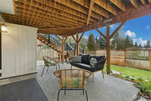 The lower-level patio is accessed from the rec room. The storage shed is included in the sale!