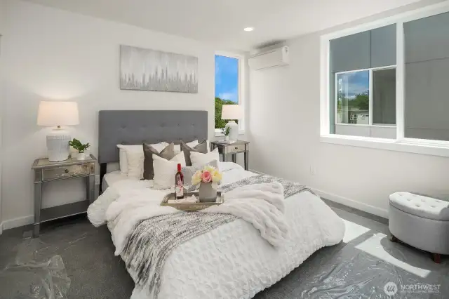 Escape to a comfortable, spacious retreat in this sumptuous bedroom with abundant light and treetop views. (Photos are of staged model home.)(Photos are of staged model home.)