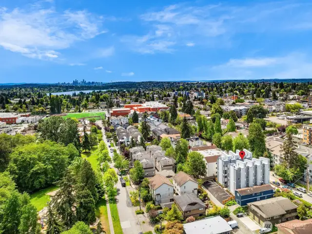 A sweeping panorama from above, showcasing the breathtaking views of the city, water, and mountains, presents this home as a true sanctuary amidst the beauty of nature, near the convenience of the city.