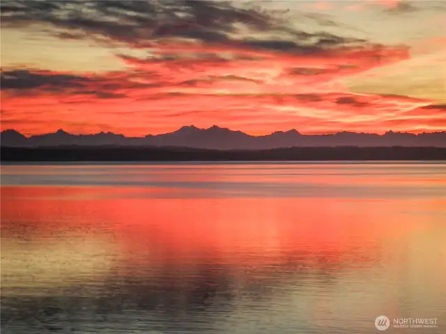 Wake up each morning to breathtaking sunrises casting rays of color over the serene waters of Puget Sound.