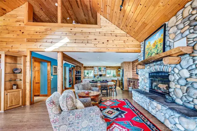 The river rock wood fireplace is a focal point and the perfect place to gather on cool Pacific Northwest evenings.