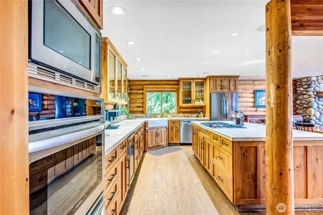 Fabulous kitchen with quality appliances, wine fridge, showcase countertops and ample storage and space.