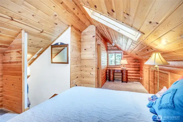 The cozy loft is a like second ensuite bedroom, with a private 3/4 bath and ample storage spaces.