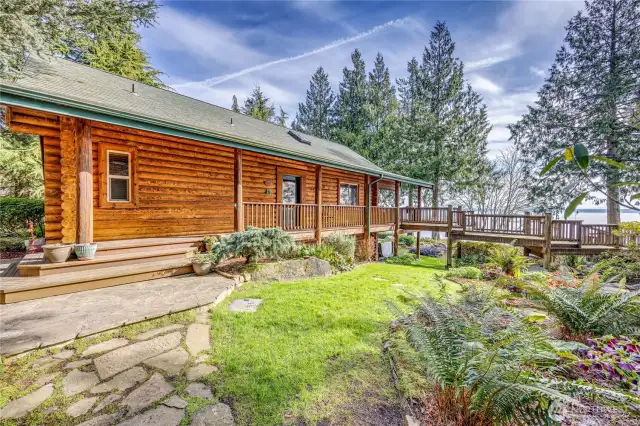 The south side of the main house has a wrap-around deck that leads to the expansive decking.