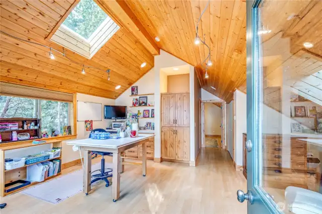 Designed to match the main home's interior, the 1-bdm apartment has been used an art studio and guest space.