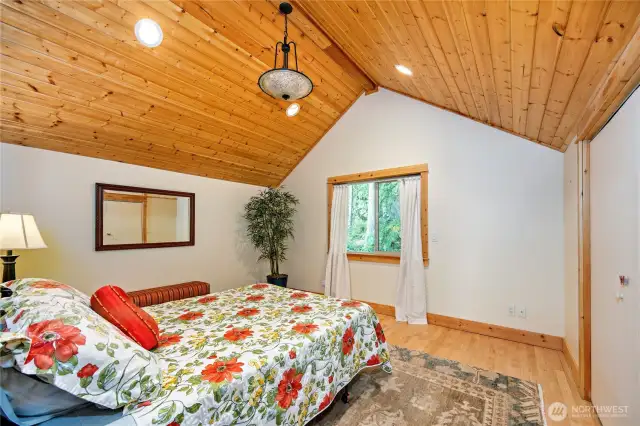 The warm and lovely bedroom in the apartment also has a large walk-in closet with storage space.