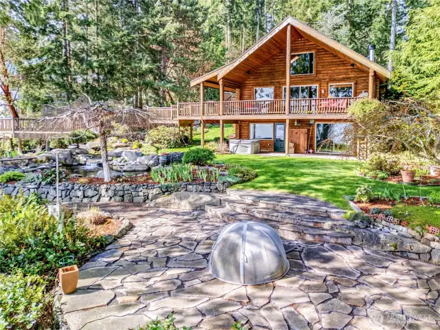 The quality and beauty of landscaping is unsurpassed with patios, waterfall, garden, forest trails & stunning views.