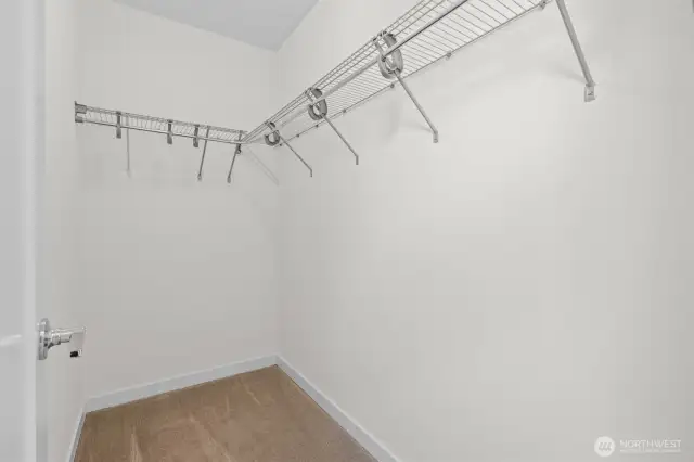 Primary bedroom walk-in closet