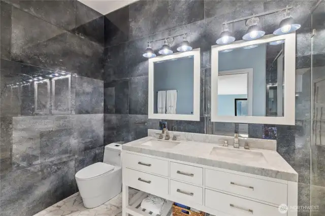 Primary bathroom with floor to ceiling stone