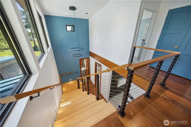 Grand staircase from upper level to main level.