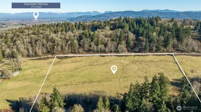 Positioned just 7.5 miles from Downtown Monroe and an easy, fun drive to Downtown Snohomish, this Property offers wide open space with excellent development potential. Surrounded by evergreens and mountain views, it blends rural atmosphere with convenient proximity to town.