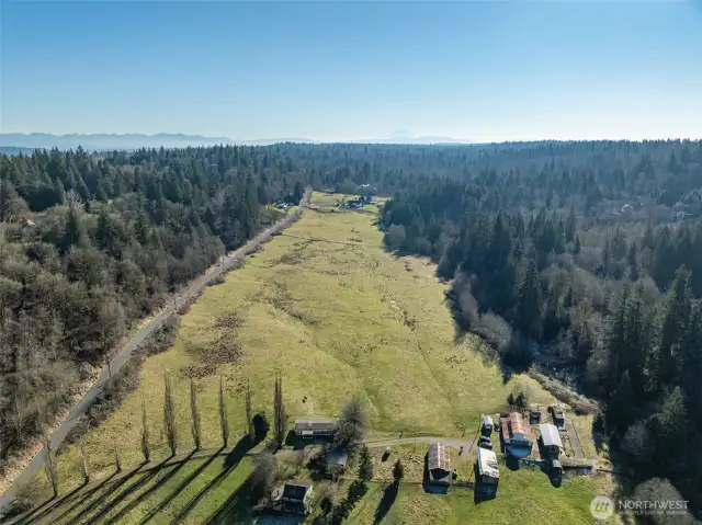 This gorgeous parcel offers lots of quiet road frontage, allowing various positionings to your future build(s). With gentle, rolling topography, it is ideal for subdivision. Various nearby septic systems' approval and connection to artisan well drilling via an easement to do so provide peace of mind for your dream build!