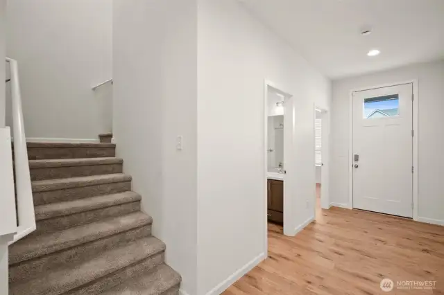 heading back out of the living room, you'll find the main floor bath & bedroom