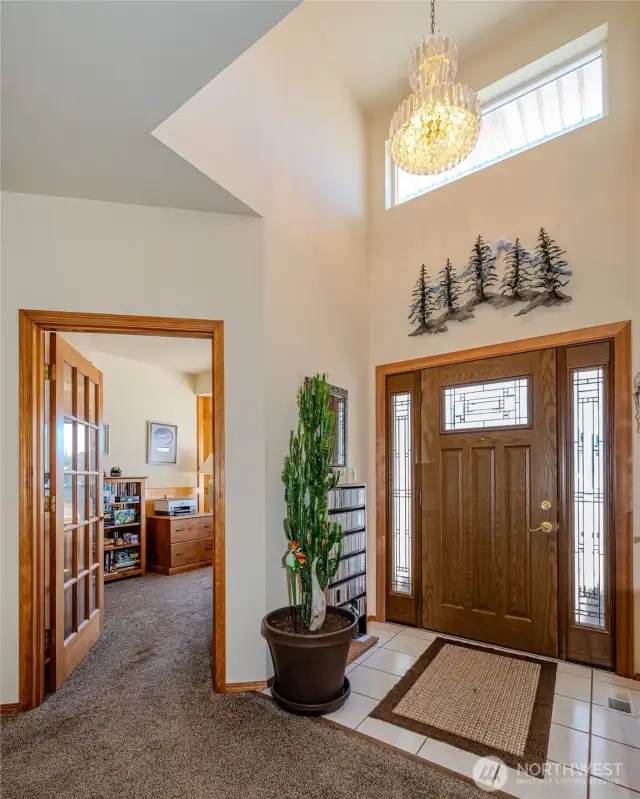 The formal entry with skylight & chandelier adds charm.
