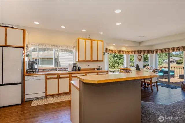 Well appointed kitchen has room for more than one chef & great cabinets.