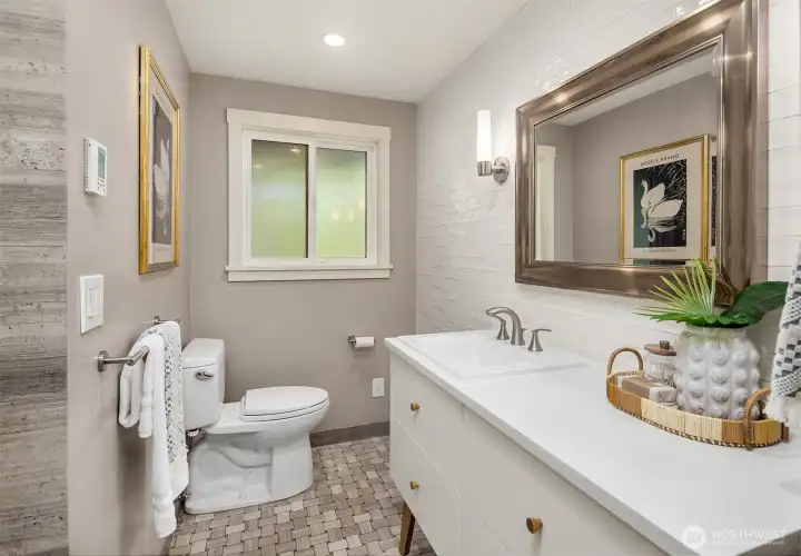 Full bathroom with custom heated tile floor.