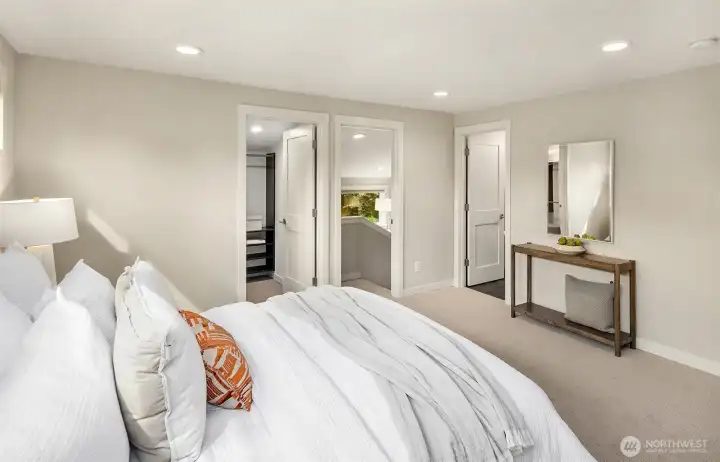 Spacious primary bedroom ensuite with walk in closet, private sitting area and laundry access.