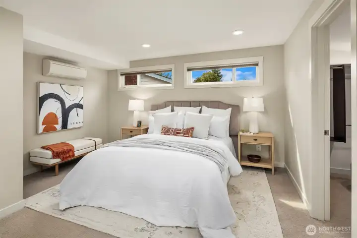 Primary bedroom easily fits King bed with walk-in closet, bath, sitting area and laundry.