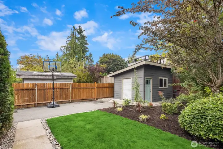 Garden shed with power and light and space for RV parking or boat.