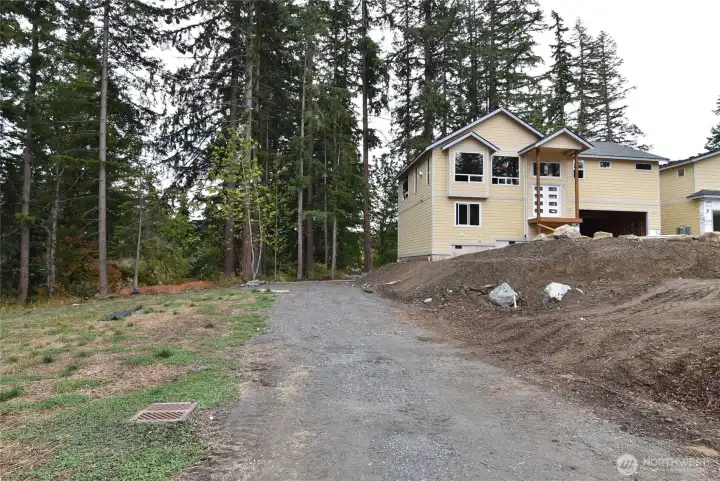 Gravel drive is only for occasional maintenance of underground stormwater storage on the adjacent open space tract.