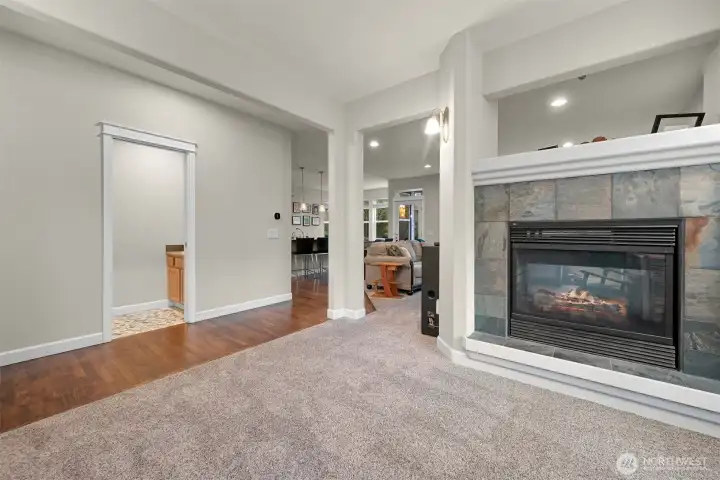 Dining area that shares fireplace with living room