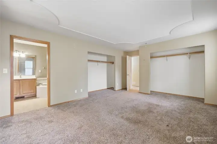 Another view of the primary bedroom suite.