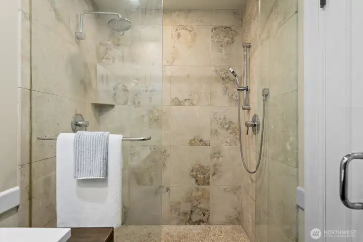 Superior finish quality works well for tenants or owner occupants alike. Limestone tile and glass shower doors are a nice touch.