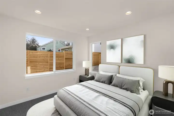 Bright secondary bedroom offering versatile space for guests or a home office