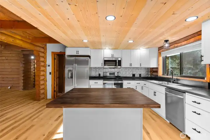 Center island with seating for two — perfect for morning coffee or casual meals.