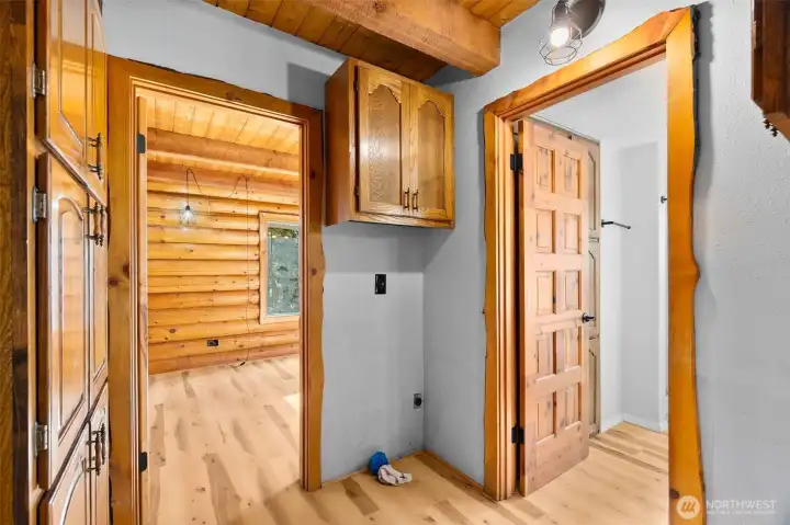 Laundry room with built-in storage and easy access to the ¾ bath, kitchen and main floor bedroom. This photo showcases the beautiful trim.