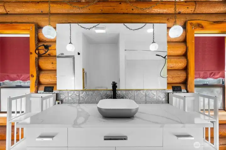 The new sink and faucet and backsplash serve as the focal point of the upstairs bath.