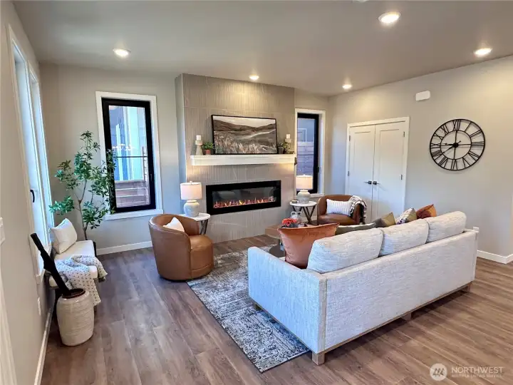 Cozy living room with electric LED fireplace with various heat controls.