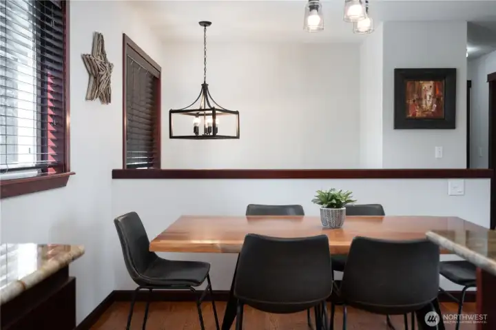Dining area with vaulted ceilings + updated lighting