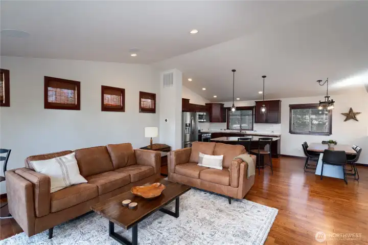 Spacious upper level lives large with vaulted ceilings, lots of natural light + easy access to deck space