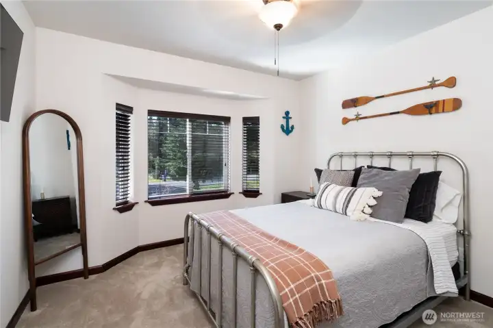 Second bedroom located on upper level of the home with closet space