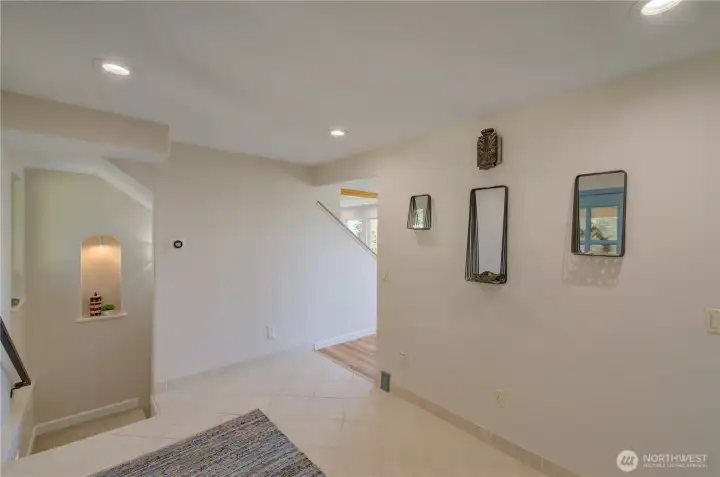 DOWNSTAIRS TO YOUR LEFT OR THROUGH OPENING TO THE LIVING ROOM