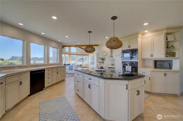TURN AROUND AND THERE IS THE STUNNINGLY BEAUTIFUL KITCHEN WITH CENTER ISLAND W/SINK