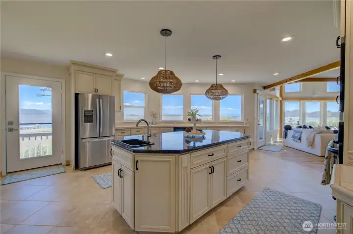 VIEW OF THE KITCHEN FROM THE WALK-IN PANTRY GAZING TOWARD THE LIVING ROOM.
