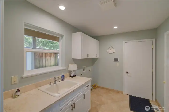 LAUNDRY/MUD ROOM/ 1/2 BATH OFF KITCHEN TO GARAGE
