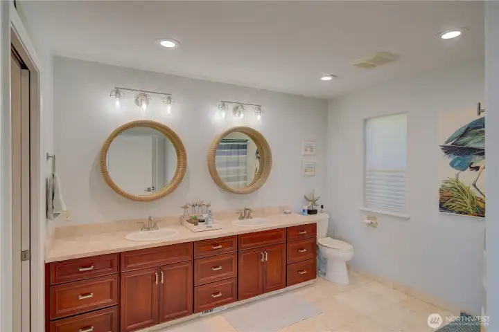 INVITING PRIMARY BATH, WALK-IN SHOWER AND ACCESS TO WALK-IN CLOSET.