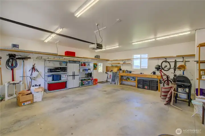 OVERSIZED TWO CAR GARAGE / WORK BENCH WITH EV OUTLET