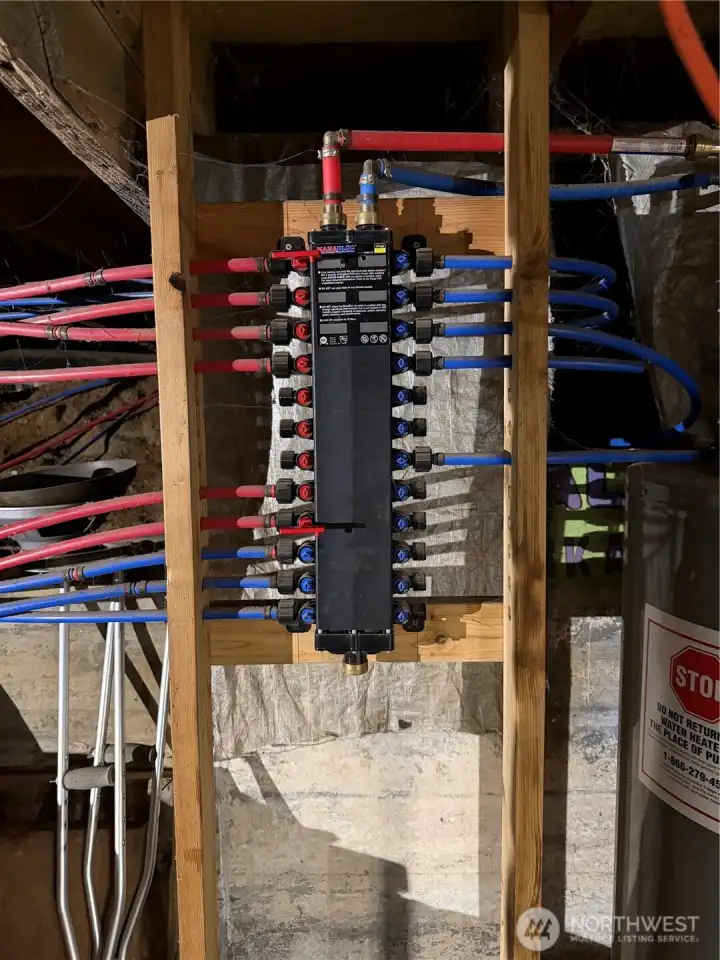 Plumbing manifold for the hot and cold water.