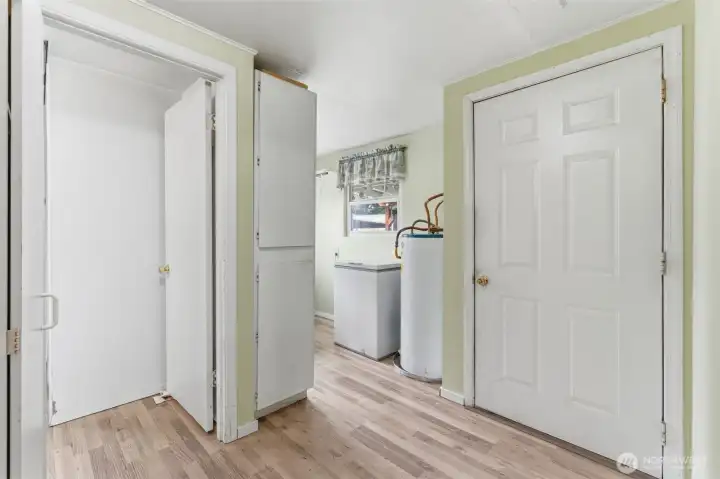 Entry space off Kitchen for back door, bath, Bed #2, & laundry.