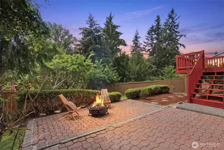 Mature landscaping creates a lush and peaceful backdrop.