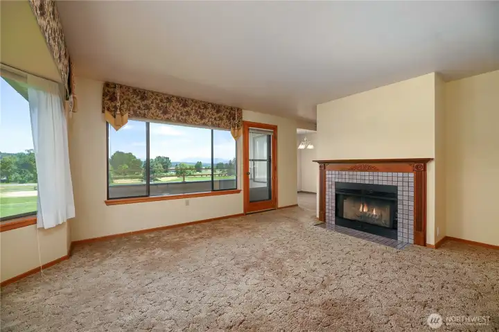 Living room dining room that is filled with natural light with all the windows. Living room dining room that is filled with natural light with all the windows.