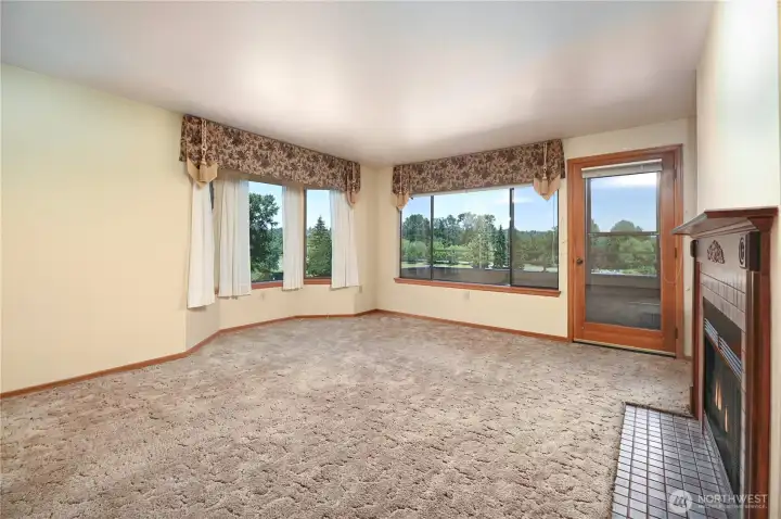 Living room dining room that is filled with natural light with all the windows. Living room dining room that is filled with natural light with all the windows.