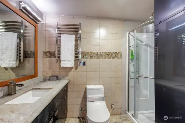 Beautiful bathroom with all the bells and whistles. Heated floor, heated towel rack, etc